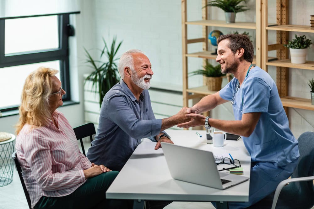 A caregiver engaging in a meaningful conversation with an elderly client
