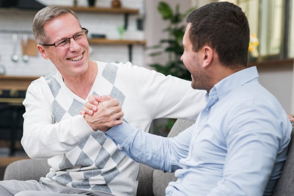 A caregiver providing empathetic support to an elderly person.